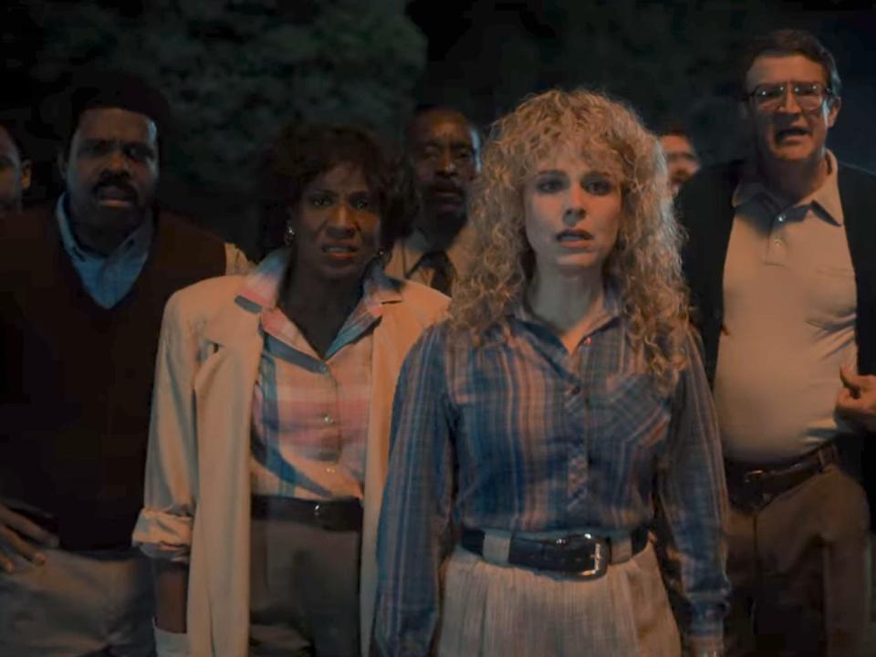 A scene from "Stranger Things" season four showing a group of parents.
