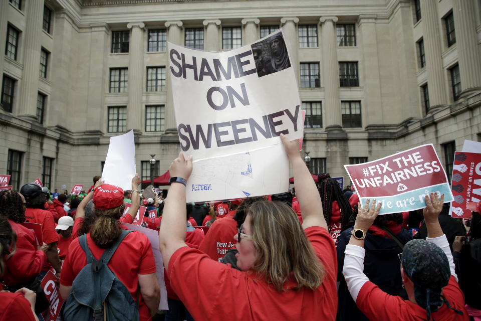 Protesters rally against benefit cuts in Trenton, N.J., Thursday, June 13, 2019. Spurred on by a tweet from U.S. Sen. Bernie Sanders, thousands of union members crowded around New Jersey's legislative annex Thursday, even spilling into the street, to protest state Senate President Steve Sweeney's calls to cut some worker benefits. (AP Photo/Seth Wenig)