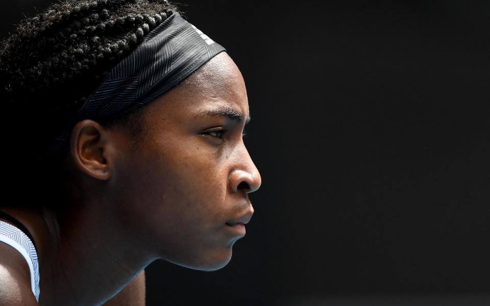 In this file photo Coco Gauff of the US waits to hit a return against Sofia Kenin of the US during their women's singles match on day seven of the Australian Open tennis tournament in Melbourne on January 26, 2020. - Rising US tennis star Coco Gauff has added her voice to those expressing outrage at the death of an unarmed black man in Minnesota who was in police hands - AFP/JOHN DONEGAN 