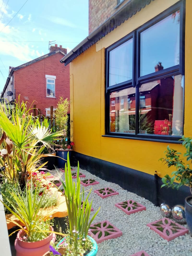 Plants in an outdoor space with yellow spaces.