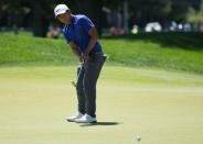 Jun 24, 2017; Cromwell, CT, USA; C.T. Pan putts on the fifth green during the third round of the Travelers Championship golf tournament at TPC River Highlands. Mandatory Credit: Bill Streicher-USA TODAY Sports