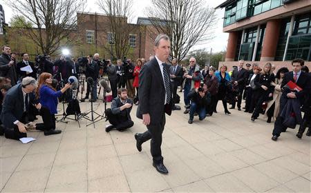 Former deputy speaker of the House of Commons Nigel Evans leaves after speaking to the media outside Preston Crown Court, northern England April 10, 2014. REUTERS/Nigel Roddis