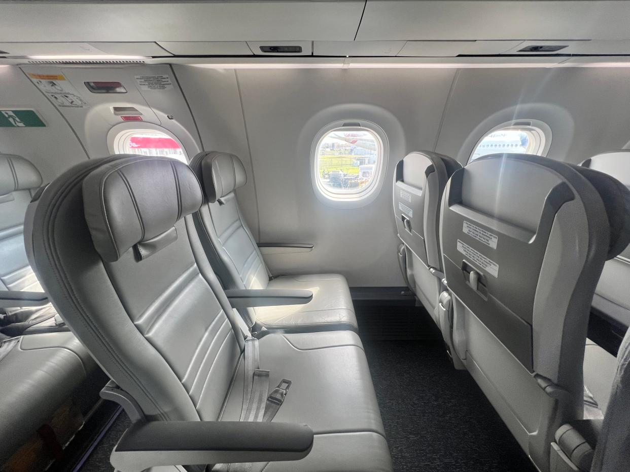 A row of two economy seats on an Embraer E195-E2 at the 2024 Farnborough Airshow