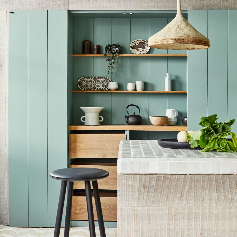 Kitchen with green painted larder cupboard