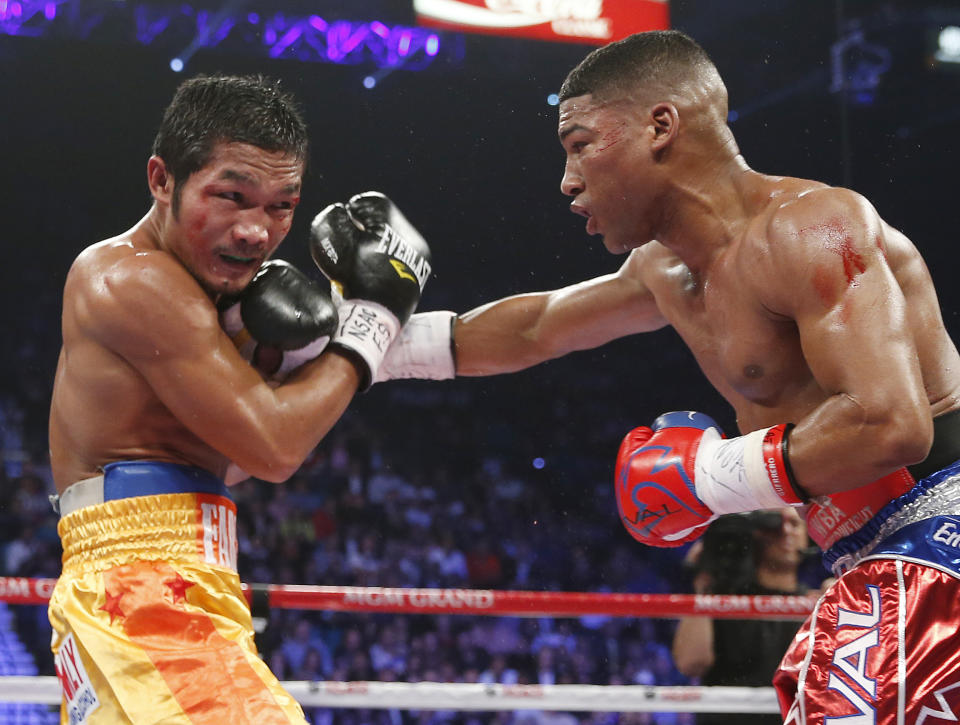 Yuriorkis Gamboa, from Miami, Fla., right, connects with a right to the chin of Michael Farenas, from the Philippines, during their WBA interim super featherweight title fight Saturday, Dec. 8, 2012, in Las Vegas.(AP Photo/Eric Jamison)