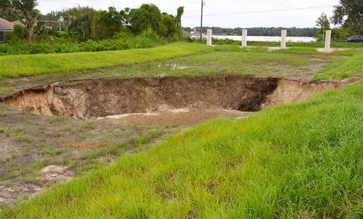 The sinkhole that opened last week near Scott Lake is "active and stable," according to Polk County officials.