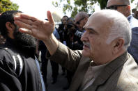 His Royal Highness Prince El Hassan bin Talal Hashemite of the Kingdom of Jordan greets worshippers outside the Al Noor mosque in Christchurch, New Zealand, Saturday, March 23, 2019. The mosque reopened today following the March 15 mass shooting. (AP Photo/Mark Baker)