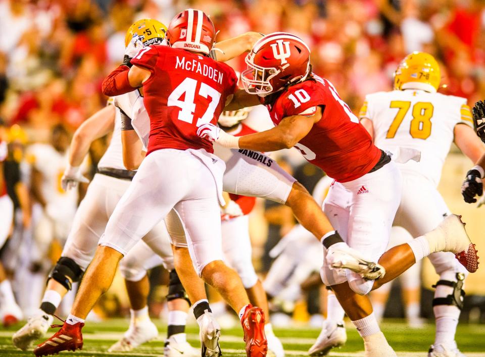 Indiana's Micah McFadden (47) and Ryder Anderson (10) tackle Idaho's Mike Beaudry (5) causing a fumble during the first half of the Indiana versus Idaho football game at Memorial Stadium on Saturday, September 11, 2021.