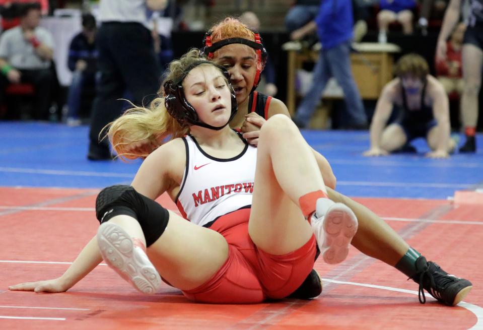 Manitowoc Lincoln’s Amellia Fowler, left, wrestles  Waukesha South’s Adrianna Beckley in a 132-pound match during the WIAA Individual State Wrestling at the Kohl Center, Thursday, February 23, 2023, in Madison, Wis.