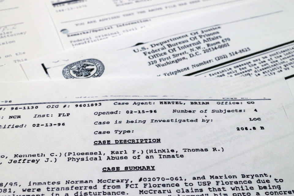 An April 22, 1996 case summary, sent by the Bureau of Prisons Office of Internal Affairs to the Justice Department's Civil Rights Division, detailing allegations that Thomas Ray Hinkle and other guards beat federal prison inmates Marion Bryant Jr. and Norman McCrary at the federal penitentiary in Florence, Colo., is photographed on Nov. 21, 2022. Hinkle, a senior official at the federal Bureau of Prisons has been repeatedly promoted, most recently to one of the highest posts in the agency. And this has happened despite his being accused of beating multiple Black inmates in the 1990s. An Associated Press investigation has found the Bureau of Prisons has continued to promote Hinkle despite numerous red flags. (AP Photo/Jon Elswick)