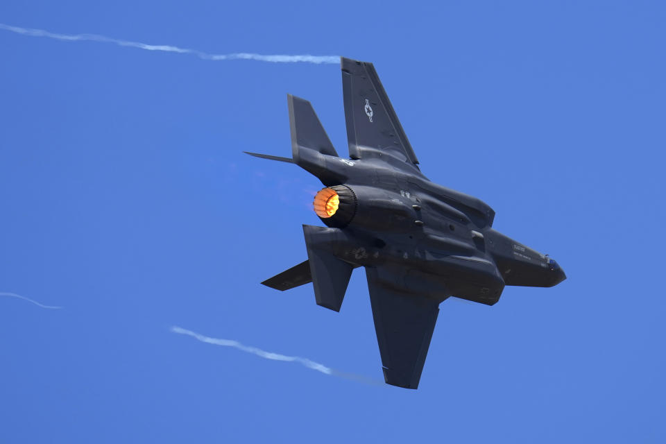 FILE - U.S. Air Force fighter aircraft F-35 performs aerobatic maneuvers on the second day of the Aero India 2023 at Yelahanka air base in Bengaluru, India, Tuesday, Feb. 14, 2023. An independent Sweden-based watchdog says the world military spending has grown for the eighth consecutive year in 2022 to an all-time high of $2240 billion leading to a sharp rise of 13% taking place in Europe, chiefly due to Russian and Ukrainian expenditure. (AP Photo/Aijaz Rahi, File)