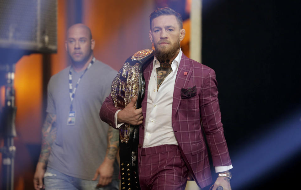 Conor McGregor arrives a news conference in New York, Thursday, Sept. 20, 2018. McGregor is returning to UFC after a two-year absence. He fights undefeated Khabib Nurmagomedov on Oct. 6, a bout certain to shatter UFC pay-per-view view records. (AP Photo/Seth Wenig)