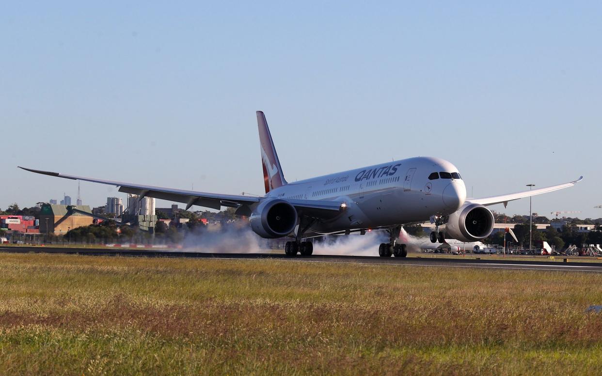 The test flight lands in Sydney after over 19 hours in the air - AFP