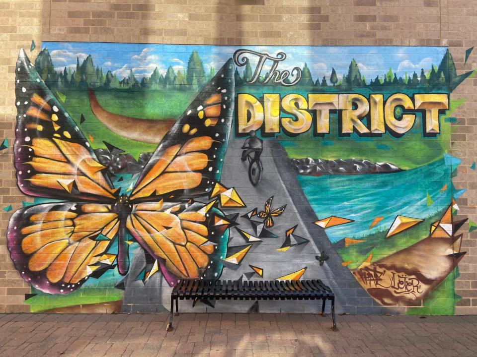 See a mural featuring a butterfly and a bicyclist on the side of the Operating Room in Ankeny.