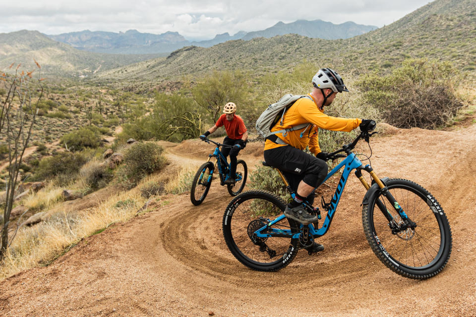 Rider climbing steep hill on Pivot Switchblade