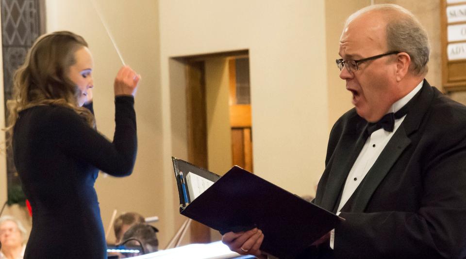 Marisa Crabb conducts as Tim LeFebvre sings bass. They will perform the Concert of Healing on June 10 at Sarah Jane Johnson Memorial United Methodist Church in Johnson City along with the Binghamton Downtown Singers.