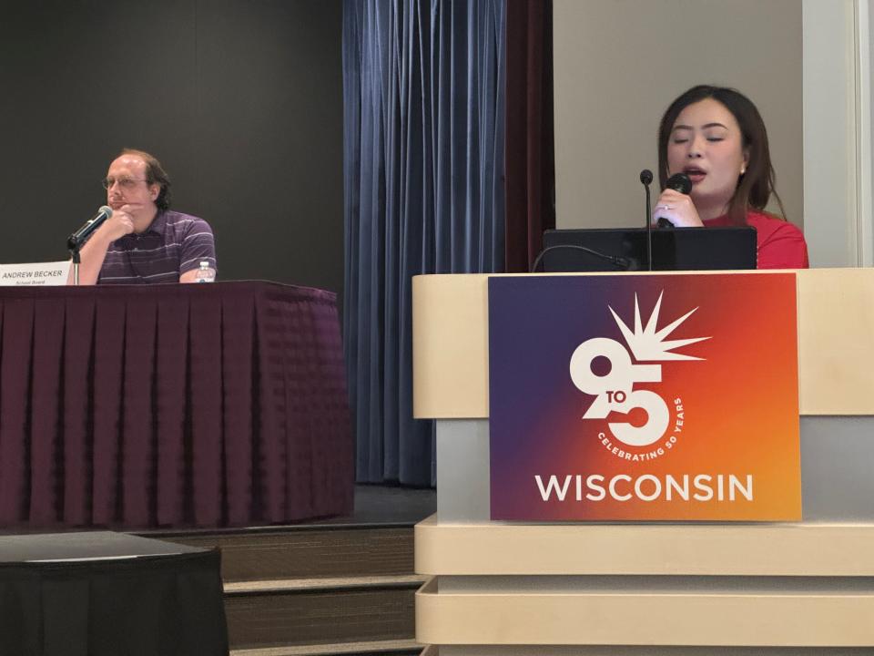 Panhia Thao, right, moderator of the spring candidates forum on Thursday poses a question to the 11 Green Bay School Board and City Council candidates while School Board incumbent Andrew Becker looks on.