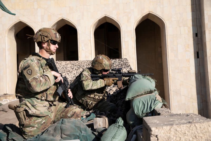 U.S. Army soldiers man a defensive position at Forward Operating Base Union III in Baghdad