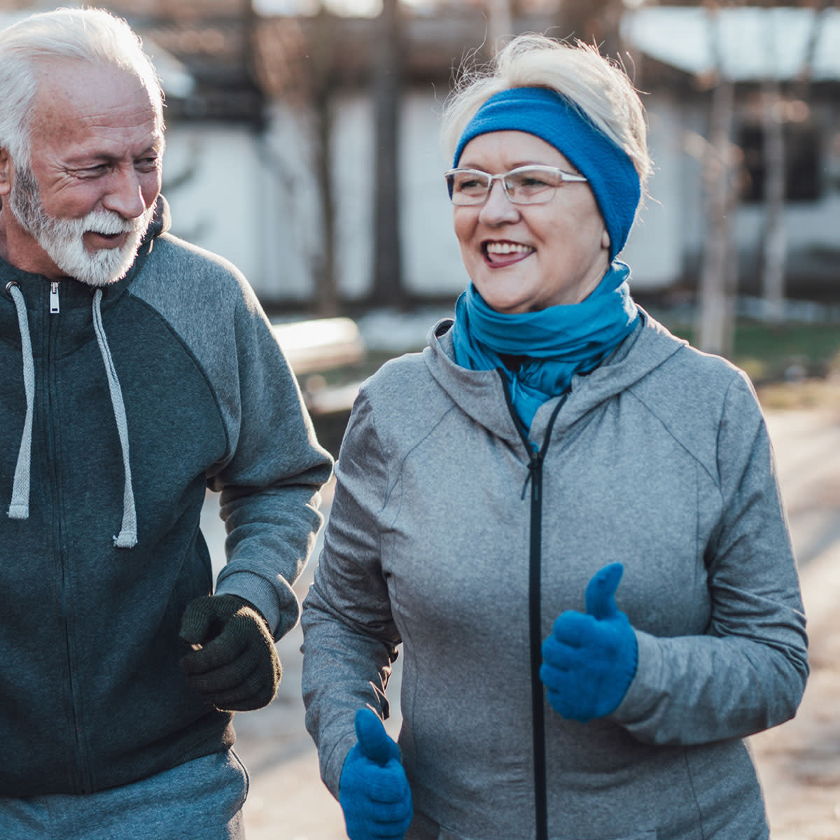 older couple exercising outdoors in winter