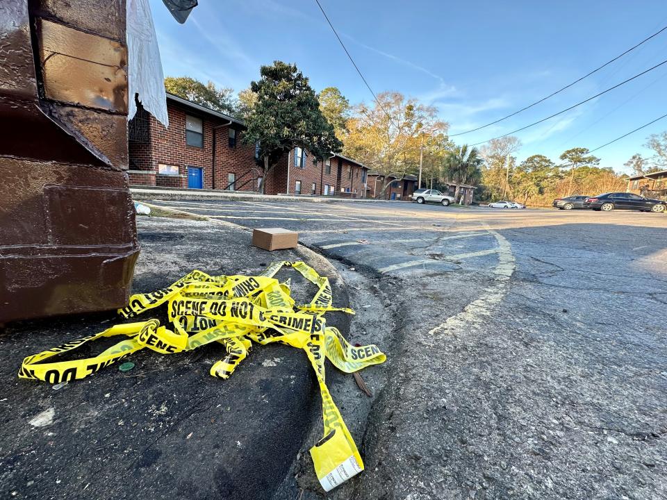 Crime scene tape was still visible at Griffin Heights Apartments on Thursday, Jan. 18, 2024, the day after two young men were gunned down at the complex on Basin Street.