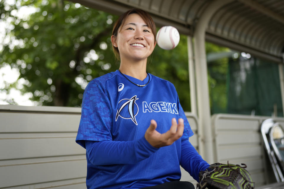 Eri Yoshida of a Japanese women's baseball team, Agekke, smiles during an interview in Oyama, Tochigi prefecture, north of Tokyo, Tuesday, May 30, 2023. The 31-year-old Japanese woman is a knuckleball pitcher with a sidearm delivery that she hopes might carry her to the big leagues in the United States or Japan. (AP Photo/Shuji Kajiyama)