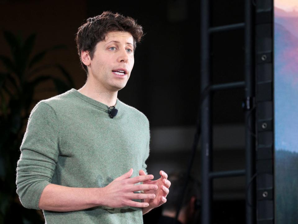 sam altman speaking on stage