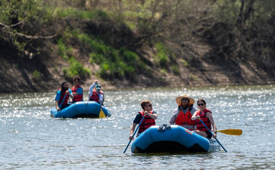 Andrew Lang (left), Keith Cruz, and Andrew’s wife Emily Lang lead another group on the water, Indianapolis, Saturday, April 23, 2022, along a stretch of the White River running between Carmel and northern Indianapolis. Friends of the White River’s Scott Salmon is teaching the workshop for people who want to learn to guide others during future rafting trips.