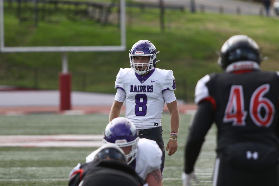 Erie Mason graduate Noah Beaudrie calls signals for Mount Union. The Purple Raiders will play the North Central Cardinals in the Division III Amos Alonzo Stagg Bowl national championship game tonight.