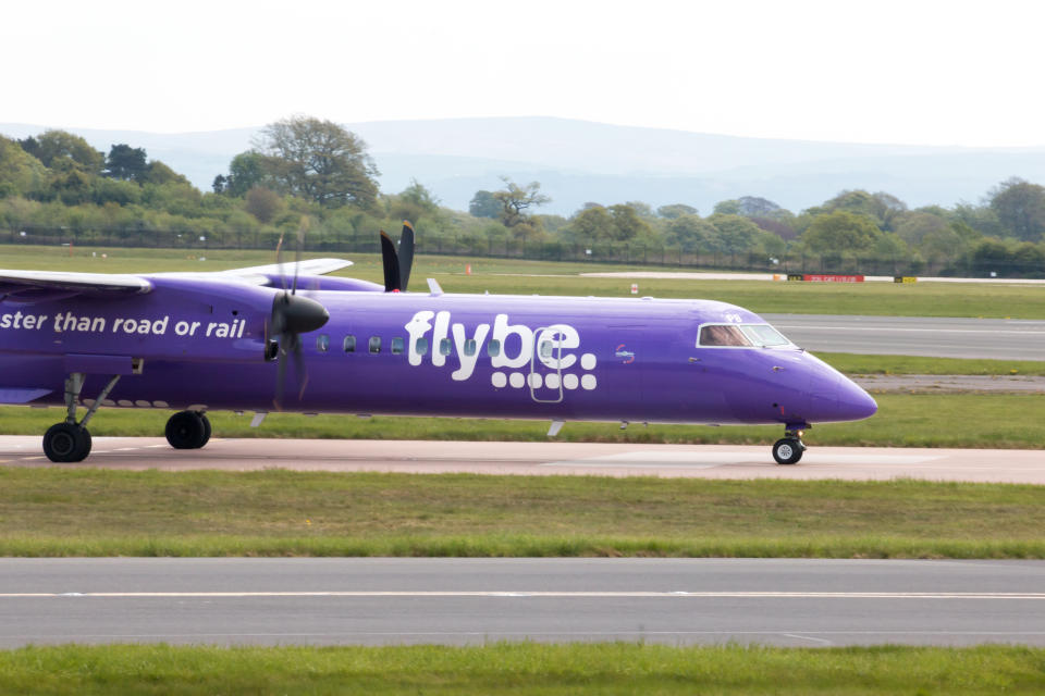 Manchester, United Kingdom - May 8, 2016: Flybe Bombardier Dash 8 Q400 twin-engine, medium range, turboprop passenger plane taxiing on Manchester International Airport tarmac.