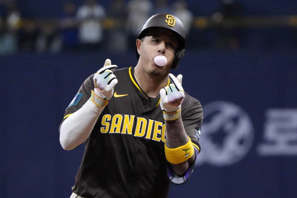 San Diego Padres' Manny Machado gestures as he rounds their after hitting a three-run home run during the ninth inning of a baseball game against the Los Angeles Dodgers at the Gocheok Sky Dome Thursday, March 21, 2024, in Seoul, South Korea. (AP Photo/Ahn Young-joon)