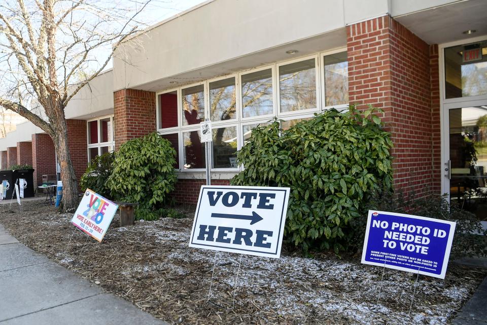 A sign directs voters where to go at the West Asheville Library during a past election. Buncombe County's libraries offer book clubs and other community services like free Wi-Fi.