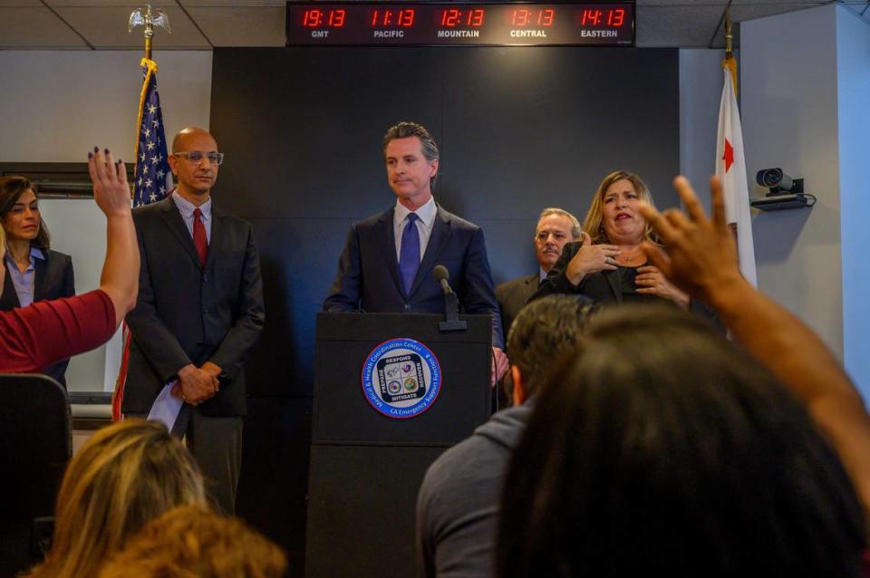 State health officials and California Governor Gavin Newsom, center, answer questions on Thursday, Feb. 27, 2020, at a public briefing in Sacramento on the states response to novel coronavirus, also known as COVID-19. The Centers for Disease Control and Prevention confirmed Wednesday a possible first case of person-to-person transmission of COVID-19 in California in the general public.