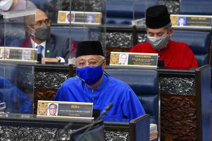 In this photo released by Malaysia's Department of Information, Malaysia's Prime Minister Ismail Sabri Yaakob, delivers the 2022 budget speech at parliament in Kuala Lumpur, Malaysia, Friday, Oct. 29, 2021. (Famer Roheni/Malaysia's Department of Information via AP)