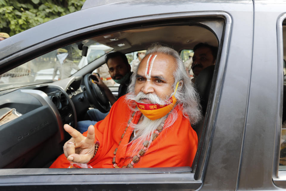 Former lawmaker from India's ruling Bharatiya Janata Party (BJP) Ram Vilas Vedanti, an accused in the 1992 attack and demolition of a 16th century mosque, celebrates outside a court in Lucknow, India, Wednesday, Sept. 30, 2020. An Indian court on Wednesday acquitted all 32 accused, including senior leaders of the ruling Hindu nationalist Bharatiya Janata Party, in the case. The demolition sparked Hindu-Muslim violence that left some 2,000 people dead. (AP Photo/Rajesh Kumar Singh)