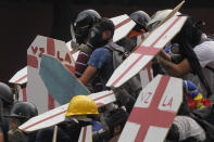 <p>Anti-government protesters use homemade shields as they face off with security forces blocking their march from reaching the National Assembly in Caracas, Venezuela, Wednesday, May 3, 2017. (AP Photo/Fernando Llano) </p>