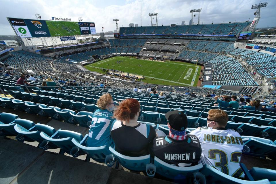 Jaguar fans take in the game and the view in the socially distanced upper deck on the east stands at TIAA Bank Field during fourth quarter game action. The Jacksonville Jaguars hosted the <a class="link " href="https://sports.yahoo.com/nfl/teams/detroit/" data-i13n="sec:content-canvas;subsec:anchor_text;elm:context_link" data-ylk="slk:Detroit Lions;sec:content-canvas;subsec:anchor_text;elm:context_link;itc:0">Detroit Lions</a> at TIAA Bank Field in <a class="link " href="https://sports.yahoo.com/nfl/teams/jacksonville/" data-i13n="sec:content-canvas;subsec:anchor_text;elm:context_link" data-ylk="slk:Jacksonville;sec:content-canvas;subsec:anchor_text;elm:context_link;itc:0">Jacksonville</a>, FL October 18, 2020. The Jaguars trailed 17 to 3 at the end of the first half of play and lost the game with a final score of 34 to 16. [Bob Self/Florida Times-Union]