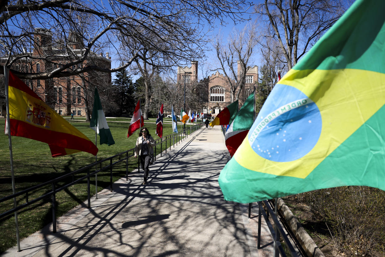 Students walk past flags on the University of Colorado campus (Michael Ciaglo for NBC News)