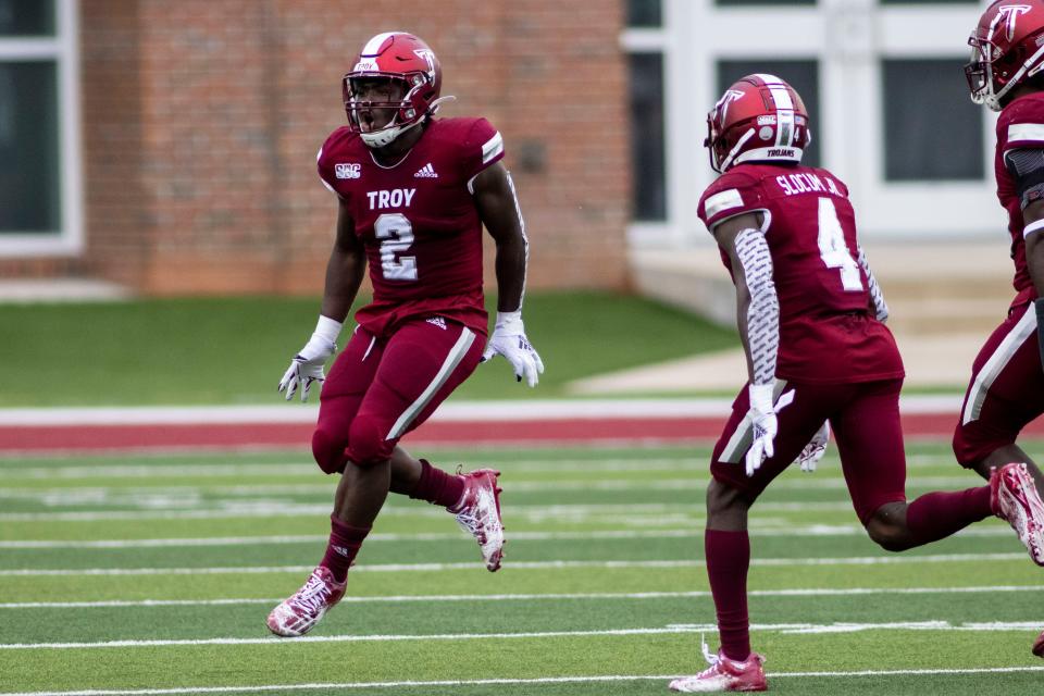 Troy linebacker Carlton Martial (2) celebrates a third-down stop against Coastal Carolina during an NCAA college football game, Saturday, Dec. 12, 2020, in Troy, Ala. (AP Photo/Vasha Hunt)