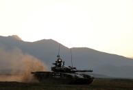 FILE PHOTO: Azerbaijani soldiers maneuver with a tank during a training at a military training and deployment center near the city of Ganja
