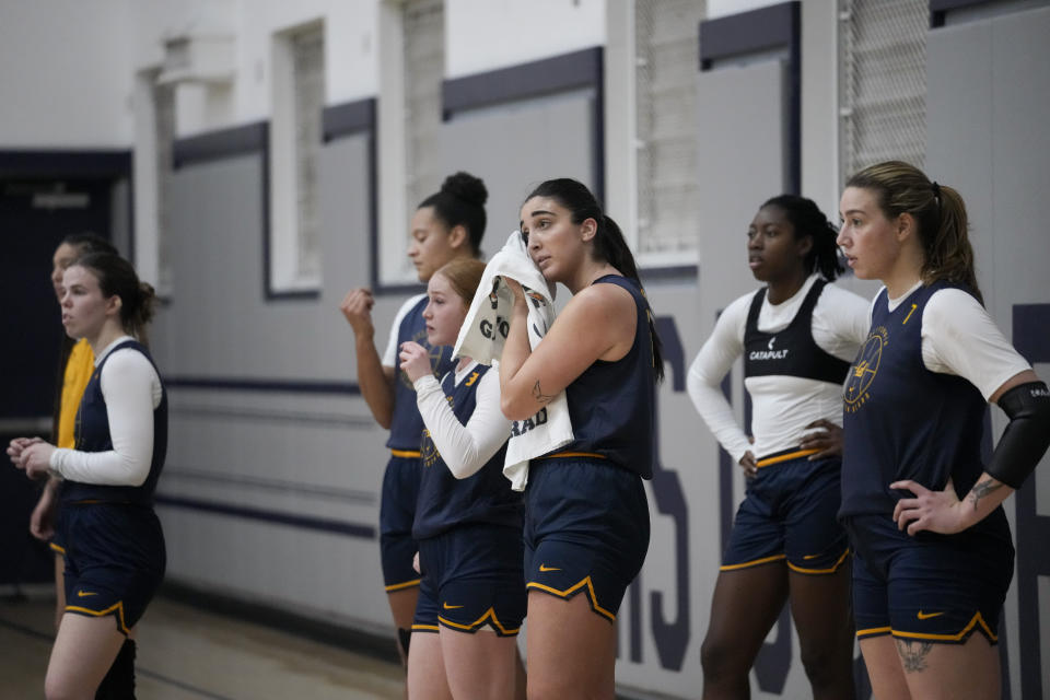 California forwards Claudia Langarita, center, and Marta Suárez, right, take a break between drills during practice Monday, Dec. 4, 2023, in Berkeley, Calif. (AP Photo/Godofredo A. Vásquez)