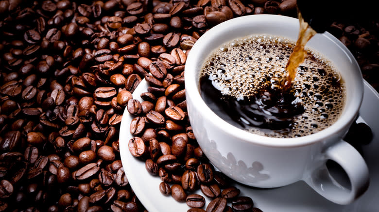 Coffee cup on beans