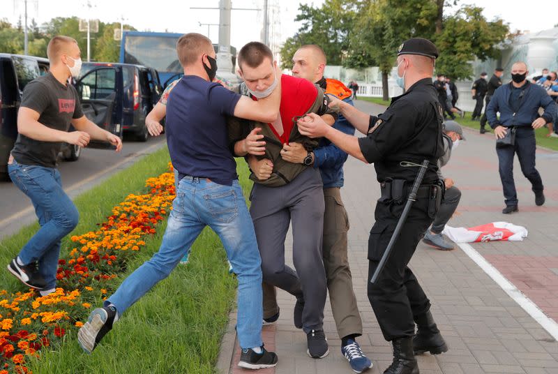 People take part in a protest after the Belarusian election commission refused to register Viktor Babariko and Valery Tsepkalo as candidates for the upcoming presidential election in Minsk