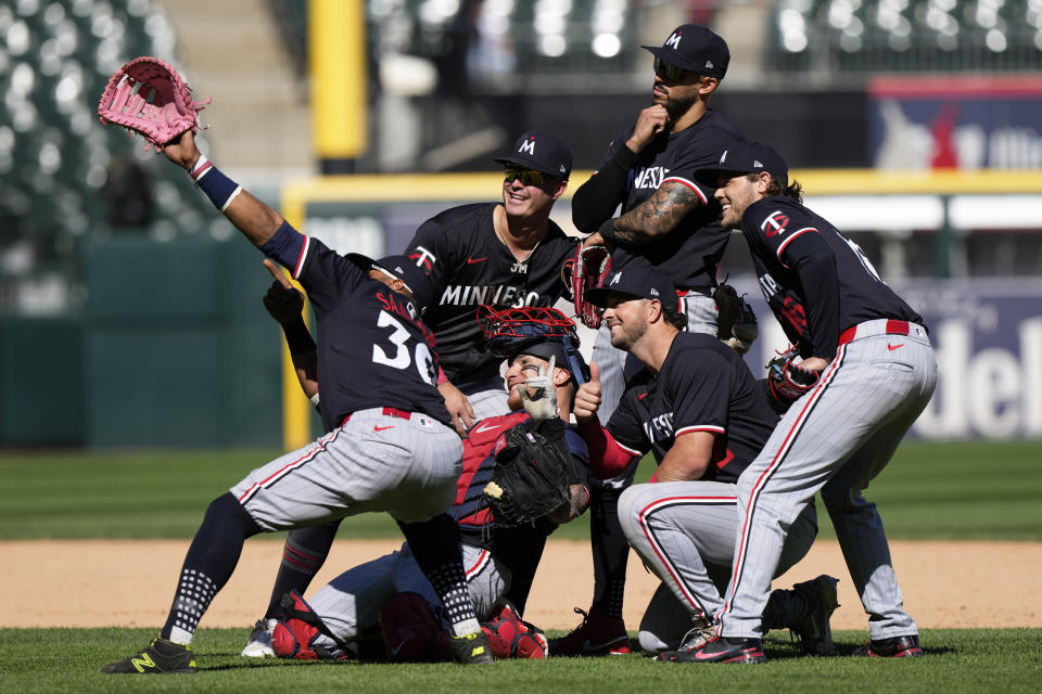 Minnesota Twins players celebrate after the Twins defeated the Chicago White Sox 10-5 in a baseball game in Chicago, Wednesday, May 1, 2024. (AP Photo/Nam Y. Huh)