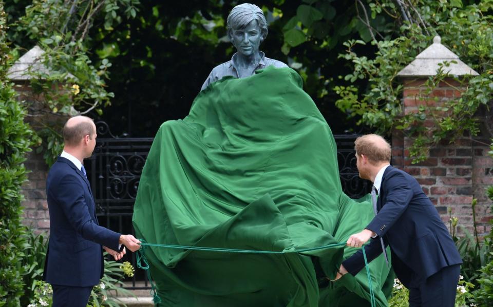 The Duke of Cambridge (left) and Duke of Sussex unveil a statue they commissioned of their mother Diana, Princess of Wales