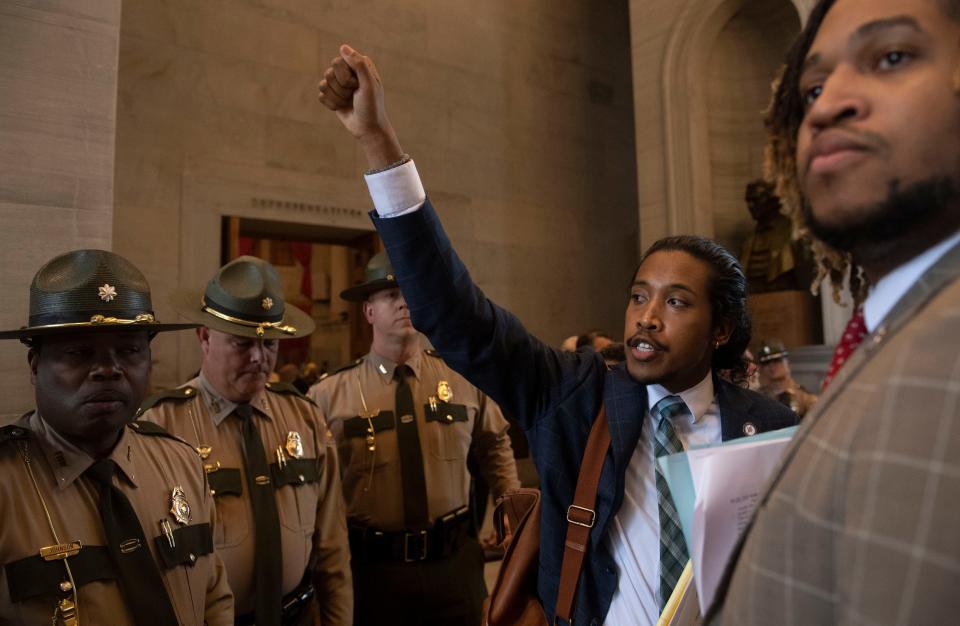 Rep. Justin Jones, D-Nashville, lifts his fit to the people protesting after House Republicans voted to silence Rep. Jones, during the special legislative session on public safety in Nashville, Tenn., on Monday, August 28, 2023.