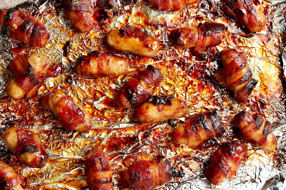 <p>Upgrade your regular <a href="https://www.delish.com/uk/cooking/recipes/a38344391/pigs-in-blanket-carbonara/" rel="nofollow noopener" target="_blank" data-ylk="slk:pigs in blankets;elm:context_link;itc:0;sec:content-canvas" class="link ">pigs in blankets</a> with these super tasty <a href="https://www.delish.com/uk/cocktails-drinks/a28826878/bucks-fizz-recipe/" rel="nofollow noopener" target="_blank" data-ylk="slk:Buck's Fizz;elm:context_link;itc:0;sec:content-canvas" class="link ">Buck's Fizz</a> versions, using a Prosecco and orange juice glaze to make the perfect <a href="https://www.delish.com/uk/cooking/recipes/g34314112/christmas-side-dishes/" rel="nofollow noopener" target="_blank" data-ylk="slk:Christmas side dish;elm:context_link;itc:0;sec:content-canvas" class="link ">Christmas side dish</a>. </p><p>Get the <a href="https://www.delish.com/uk/cooking/recipes/a41585039/bucks-fizz-pigs-in-blankets/" rel="nofollow noopener" target="_blank" data-ylk="slk:Buck's Fizz Pigs In Blankets;elm:context_link;itc:0;sec:content-canvas" class="link ">Buck's Fizz Pigs In Blankets</a> recipe. </p>
