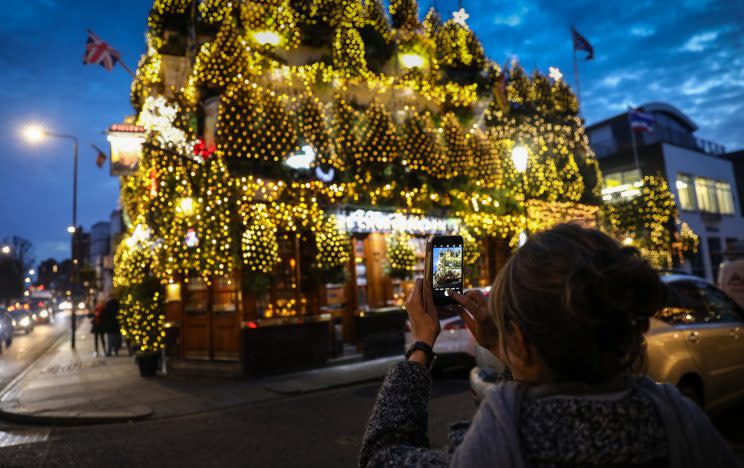 More than 20,000 lights are on the Churchill Arms pub (SWNS)