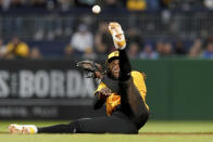 Pittsburgh Pirates shortstop Oneil Cruz fields a base hit by Chicago Cubs' Ian Happ during the fourth inning of a baseball game Friday, May 10, 2024, in Pittsburgh. (AP Photo/Matt Freed)