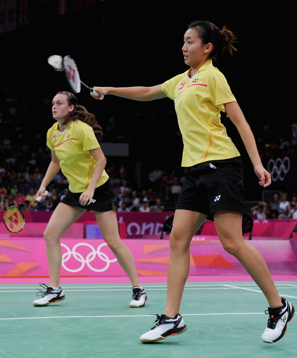 LONDON, ENGLAND - JULY 29: Alex Bruce (L) and Michele Li (R) of Canada return a shot against Ha Na Kim and Kyung Eun Jung of Korea during their Women's Doubles Badminton on Day 2 of the London 2012 Olympic Games at Wembley Arena on July 29, 2012 in London, England. (Photo by Michael Regan/Getty Images)