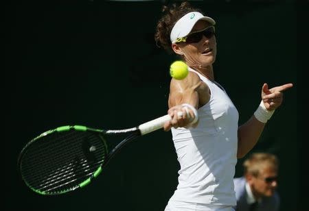 Samantha Stosur of Australia hits a shot during her match against Danka Kovinic of Montenegro at the Wimbledon Tennis Championships in London, June 29, 2015. REUTERS/Stefan Wermuth